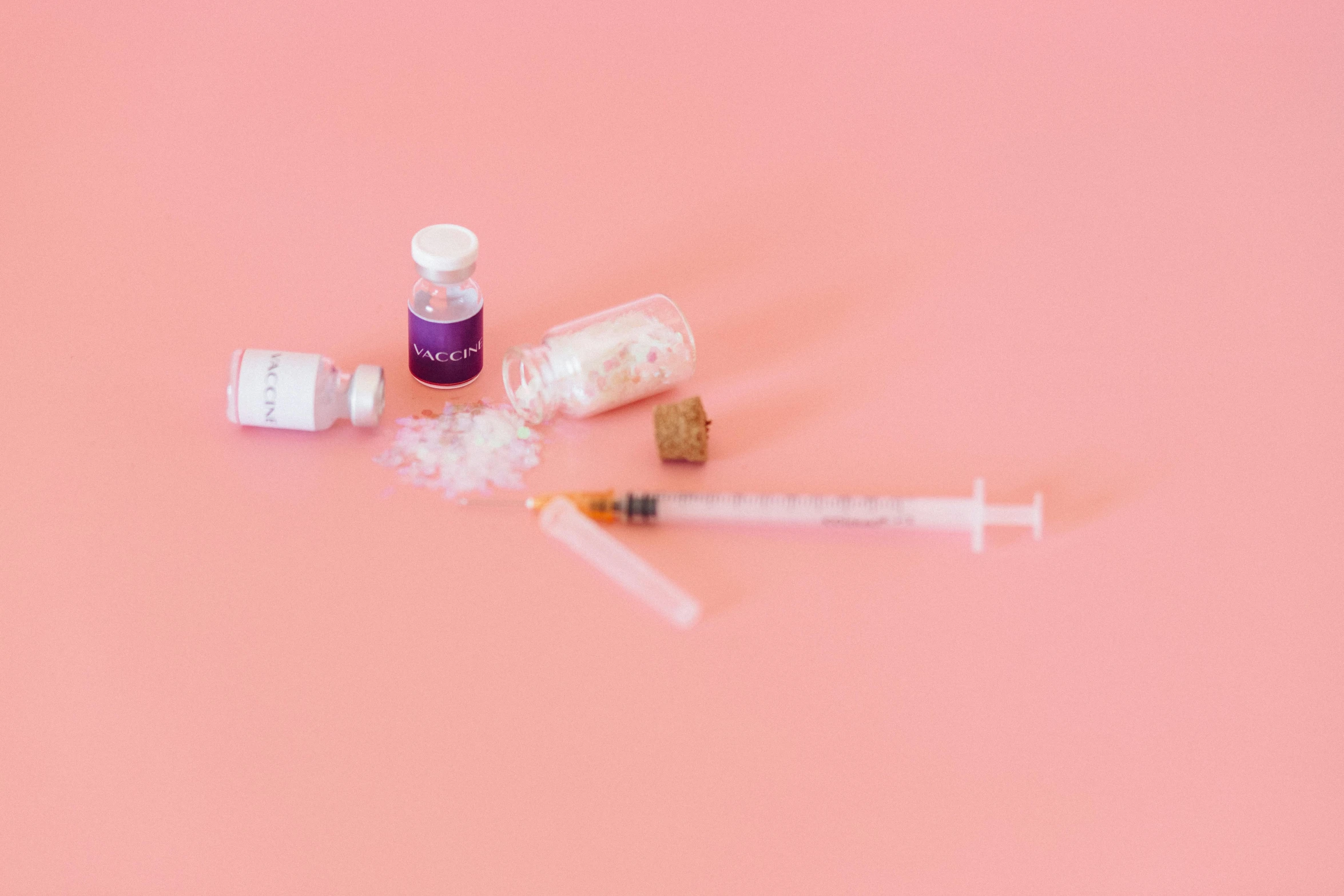 a close up of a syll on a pink surface, by Jeanna bauck, pexels, syringes, ingredients on the table, overdose, miniatures