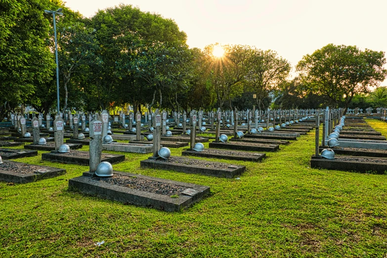 a cemetery filled with lots of tombstones and trees, by Bernardino Mei, hurufiyya, evening sun, fan favorite, sri lanka, in australia