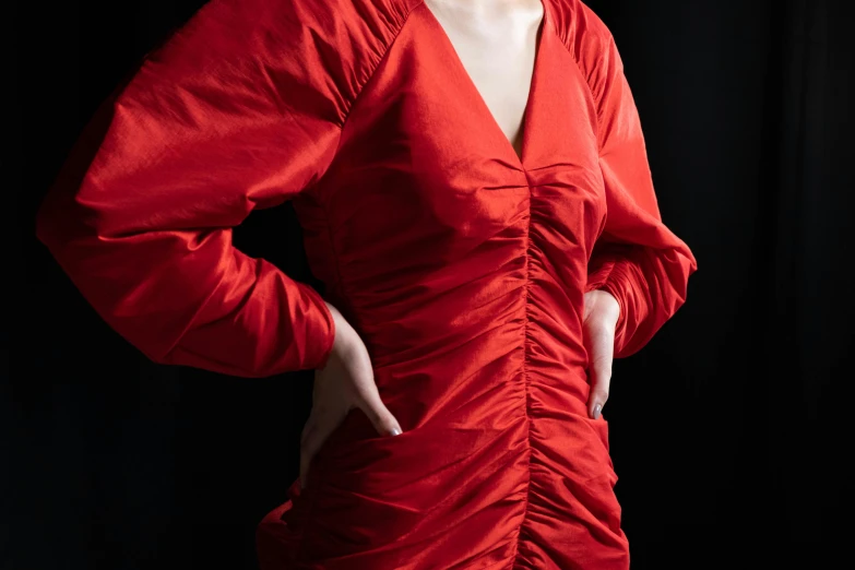 a woman in a red dress posing for a picture, an album cover, inspired by Elsa Bleda, pexels contest winner, visual art, tight wrinkled cloath, voluminous sleeves, marvelous designer substance, silk dress