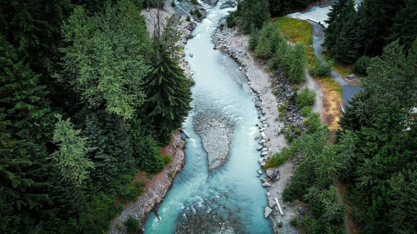 a river running through a lush green forest, an album cover, pexels contest winner, hurufiyya, whistler, wide high angle view, vancouver, teal aesthetic