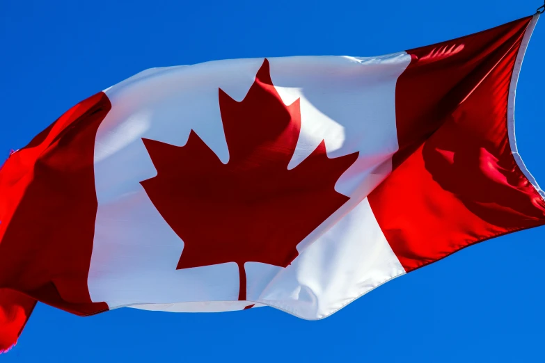 a canadian flag blowing in the wind, pexels contest winner, hurufiyya, clear blue sky, avatar image, thumbnail, 15081959 21121991 01012000 4k