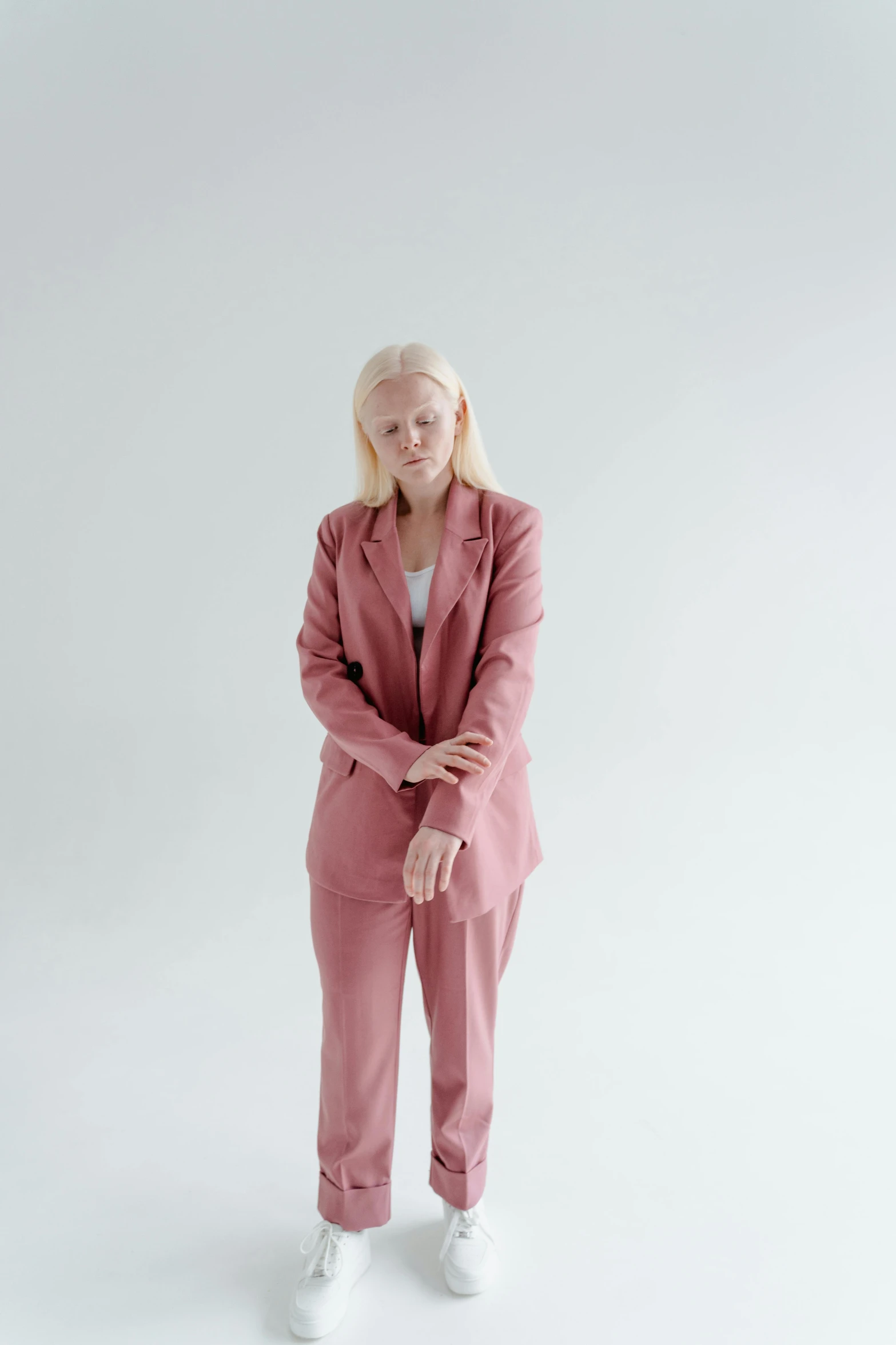 a woman in a pink suit posing for a picture, by Gavin Hamilton, intense albino, julia hetta, high quality image, real life size