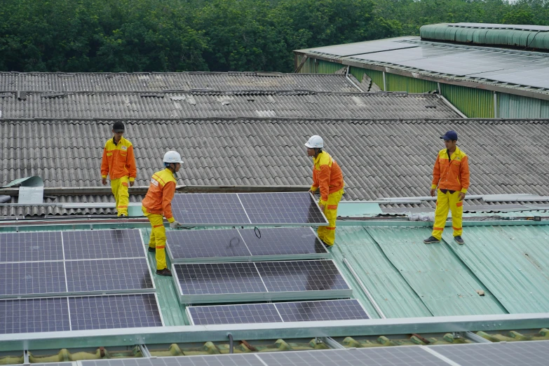 a group of men standing on top of a roof, by Xul Solar, singapore, partially operational, taiwan, green floor