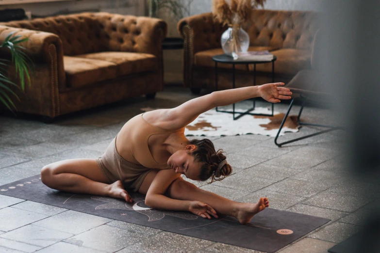 a man and a woman doing yoga together, by Emma Andijewska, pexels contest winner, brunette fairy woman stretching, at home, thigh focus, manuka