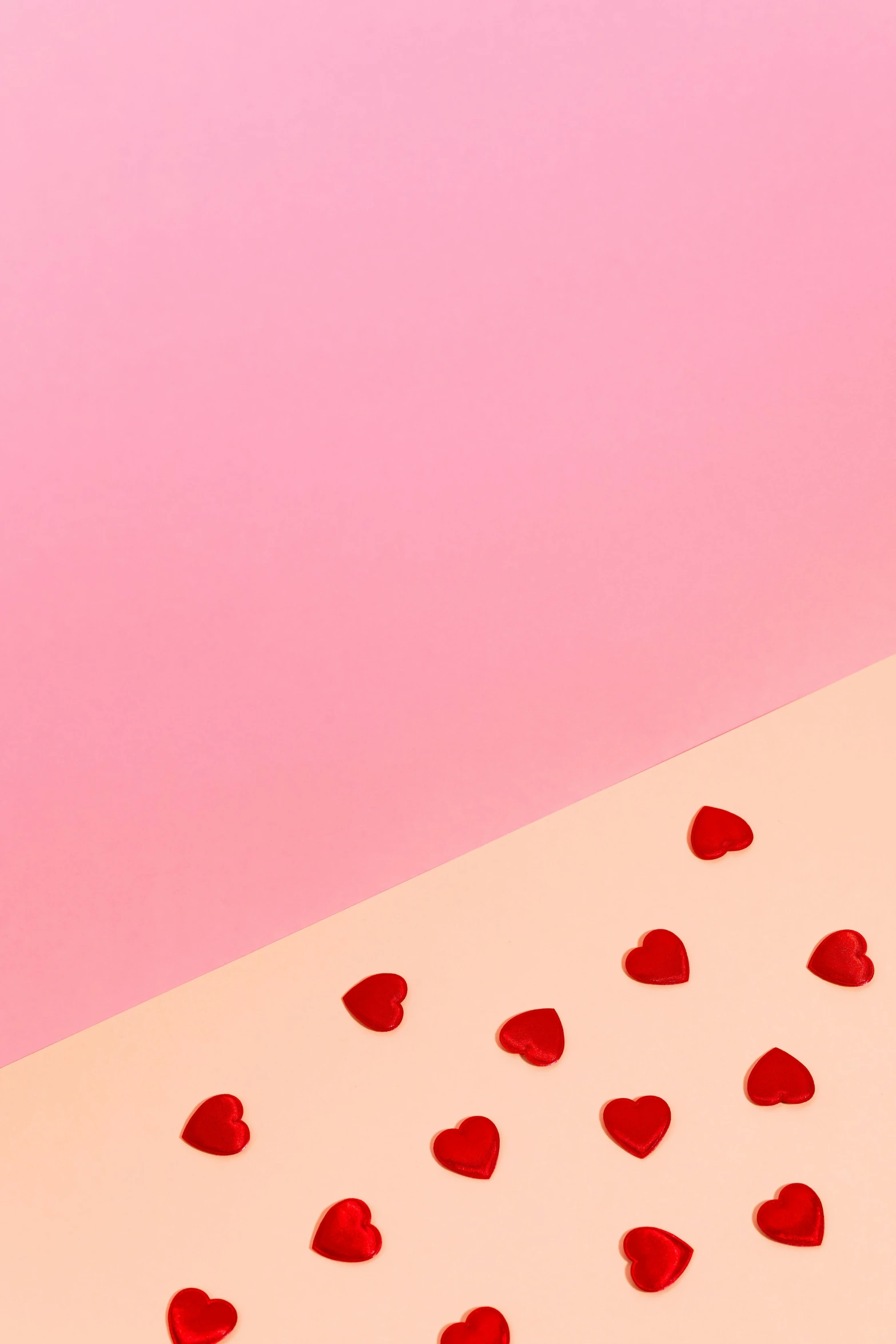 a couple of cupcakes sitting on top of a table, an album cover, by Julia Pishtar, trending on unsplash, visual art, hearts, made of candy, material design, detail shot