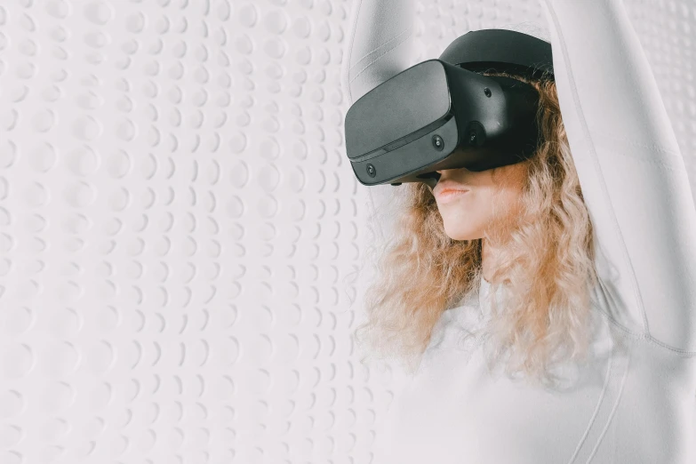 a woman wearing a virtual reality headset, by Adam Marczyński, trending on unsplash, hypermodernism, black 3 d cuboid device, avatar image, zero gravity, liquid headdress