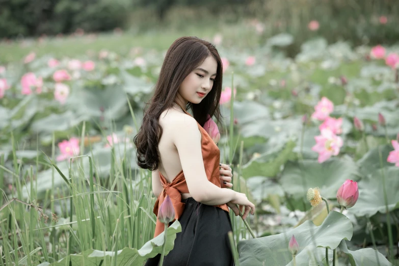 a woman standing in a field of flowers, inspired by Cui Bai, pexels contest winner, standing gracefully upon a lotus, handsome girl, avatar image, asian