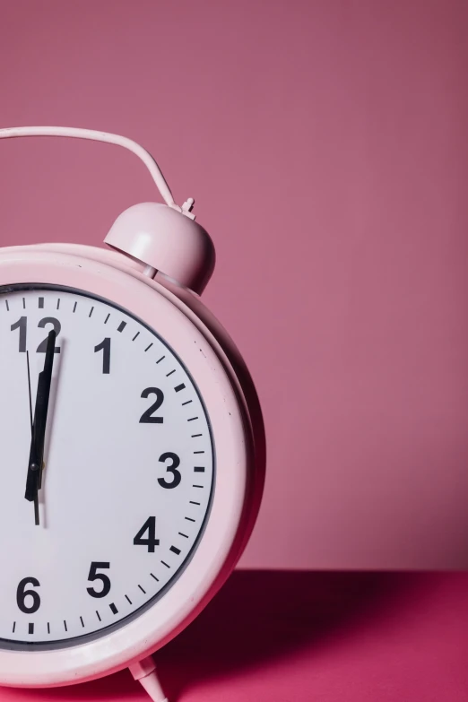 a pink alarm clock on a pink surface, by Matija Jama, trending on pexels, happening, timelapse, half image, historical, insomnia