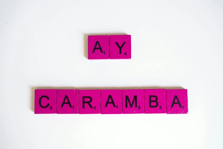 a couple of pink scrabbles sitting on top of a white surface, inspired by Peter Alexander Hay, carmen sings beautifully, am a naranbaatar ganbold, let's play, cinnamon