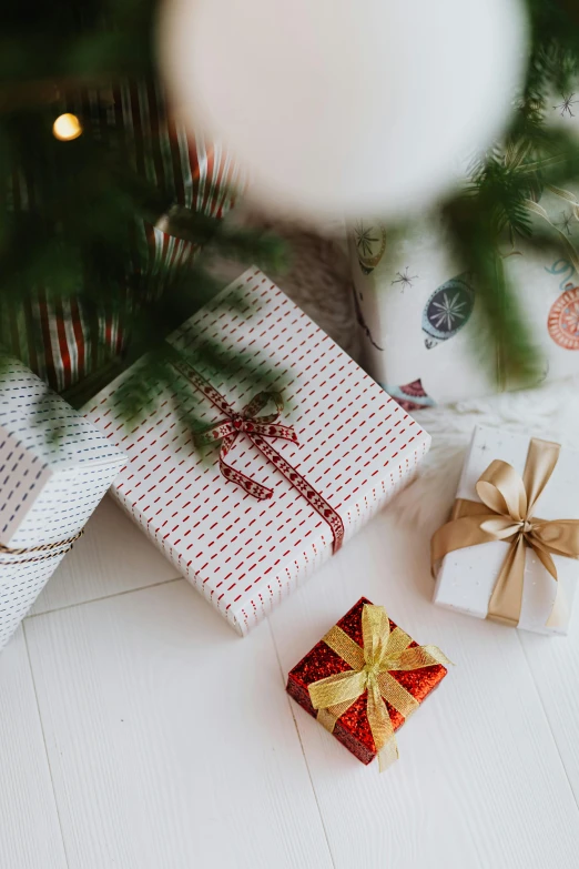 a close up of presents under a christmas tree, happening, square, white, thumbnail, patterned