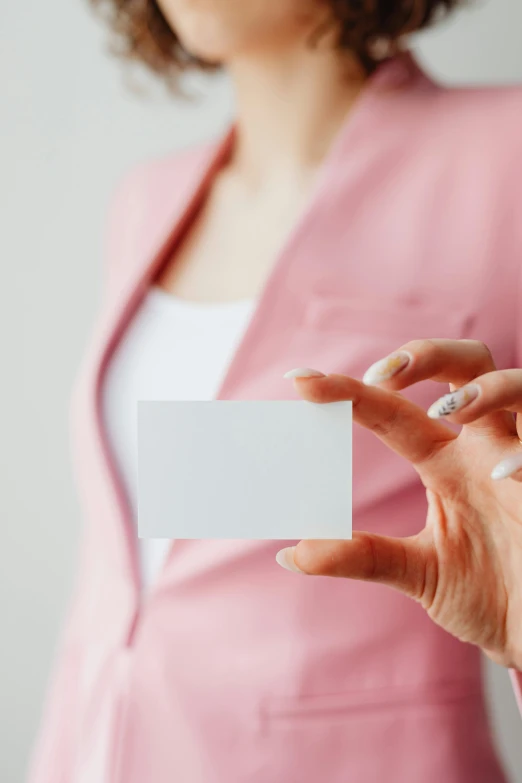 a woman holding a business card in her hand, an album cover, pexels, square, 15081959 21121991 01012000 4k, made of lab tissue, glossy white