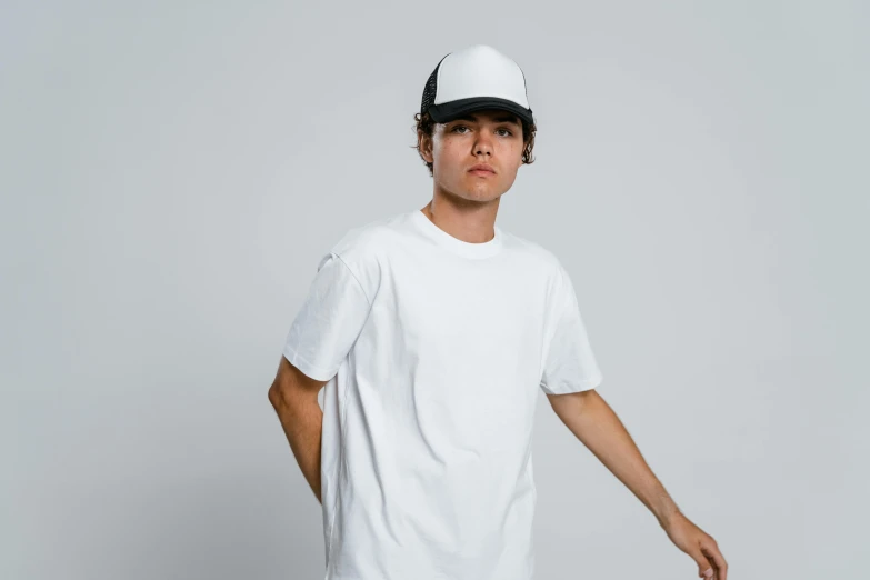 a young man in a white t - shirt is holding a skateboard, unsplash, trucker hat, 9 9 designs, tony sandoval. 8 k realistic, lachlan bailey