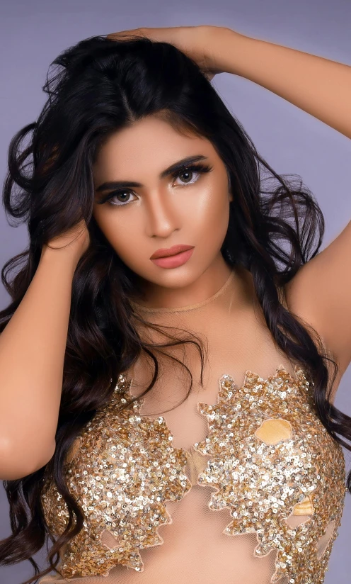 a woman in a gold dress posing for a picture, by Robbie Trevino, tanned ameera al taweel, close - up studio photo, 18 years old, 15081959 21121991 01012000 4k