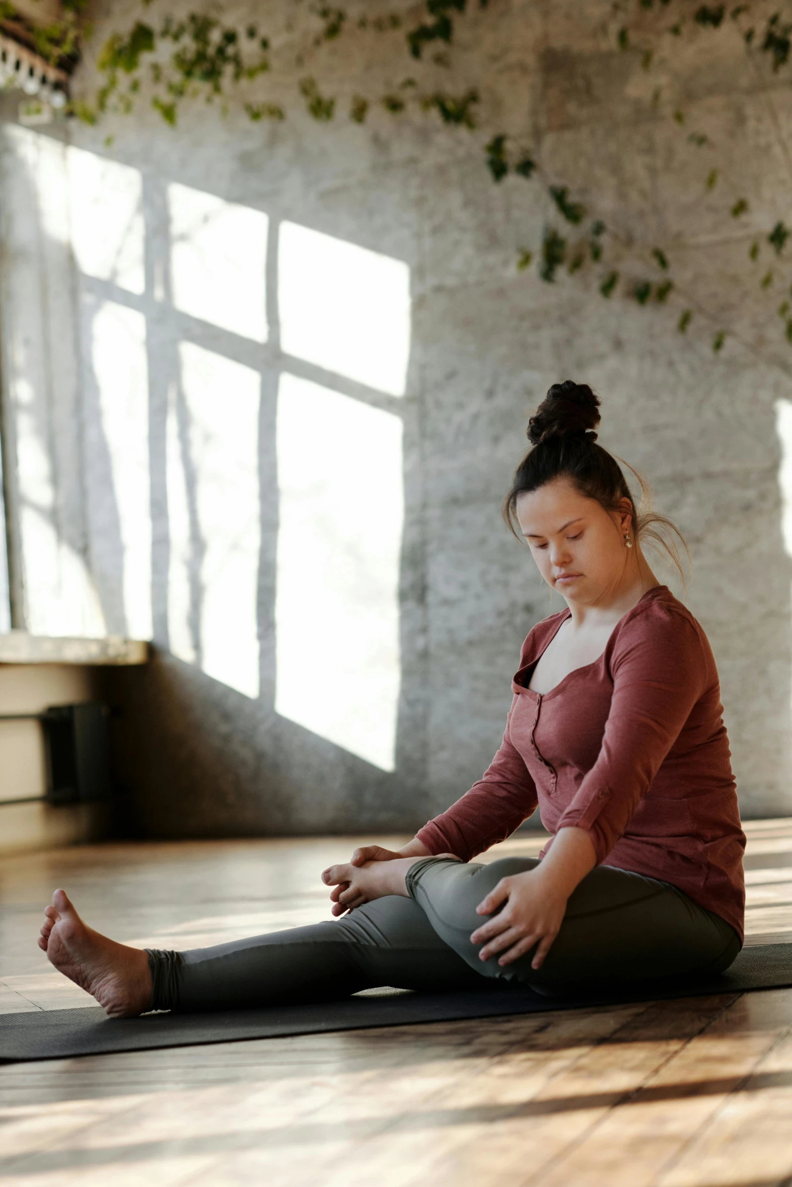 a woman sitting on a yoga mat in a room, pexels contest winner, renaissance, plus-sized, profile image, sorrow, centered full body pose