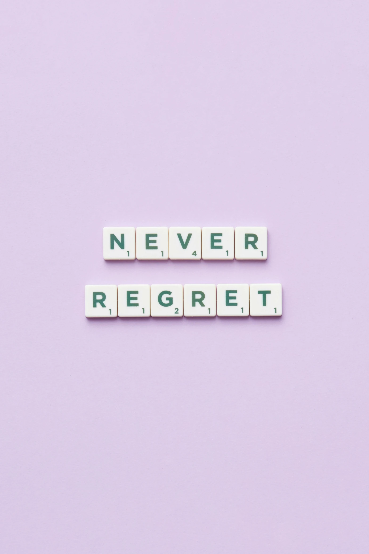 the words never regret spelled in scrabbles on a purple background, a picture, by Olivia Peguero, dream aesthetic, white background, anything, nfts