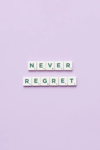 the words never regret spelled in scrabbles on a purple background, a picture, by Olivia Peguero, dream aesthetic, white background, anything, nfts