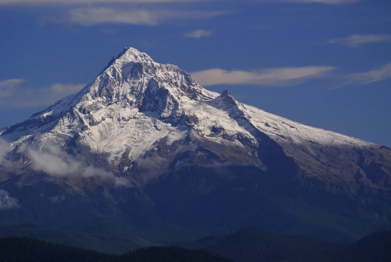 a mountain covered in snow under a blue sky, by Peter Churcher, pexels contest winner, sumatraism, cascadia, towering over your view, profile image, less detailing