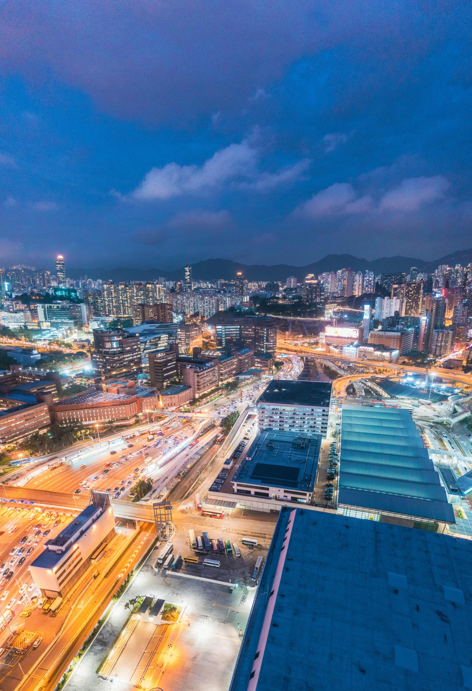 an aerial view of a city at night, pexels contest winner, a still of kowloon, golden and blue hour, square, 4k press image