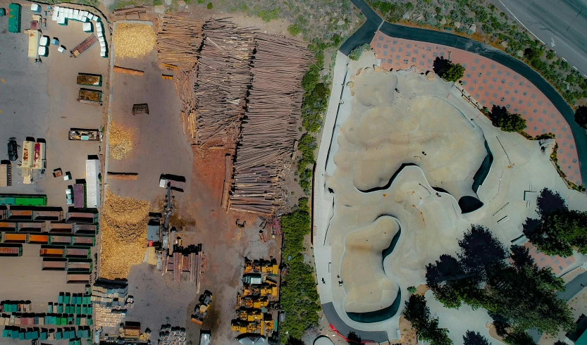 a bird's eye view of a skate park, an album cover, by Lee Loughridge, unsplash contest winner, land art, construction site, eucalyptus trees, digger land, displacement mapped