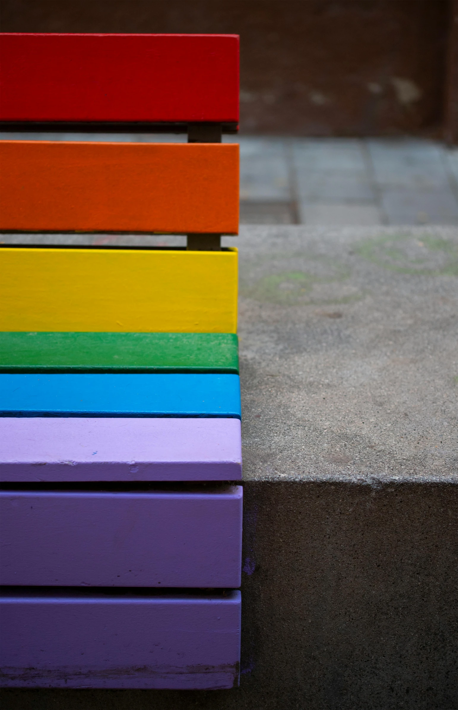 a colorful bench sitting on top of a sidewalk, by Doug Ohlson, 2 5 6 colours, close up image, lgbt, rectangle