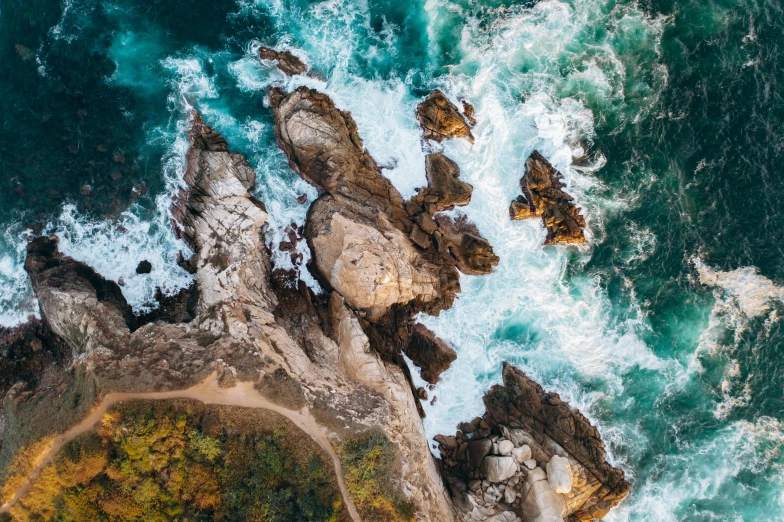 a view of the ocean from a bird's eye view, pexels contest winner, process art, waves crashing at rocks, thumbnail, conde nast traveler photo, icon