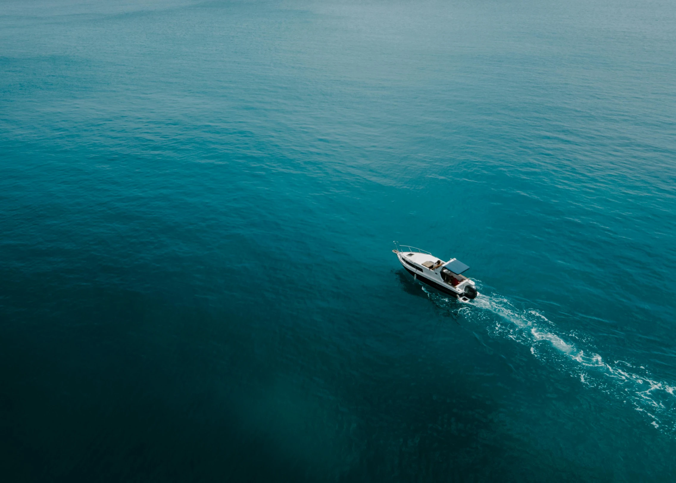 a boat in the middle of a large body of water, pexels contest winner, looking down on the camera, lachlan bailey, high quality photo, extremely high resolution