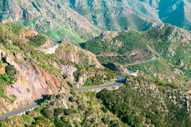 an aerial view of a winding mountain road, pch, avatar image, promo image, monserrat gudiol