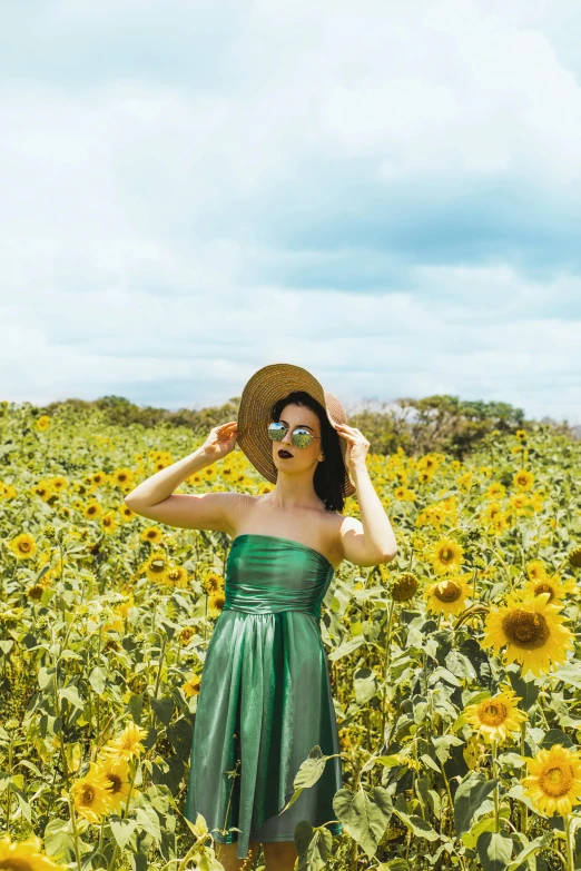 a woman standing in a field of sunflowers, pexels contest winner, color field, green dress, with sunglass, tube-top dress, taiwan