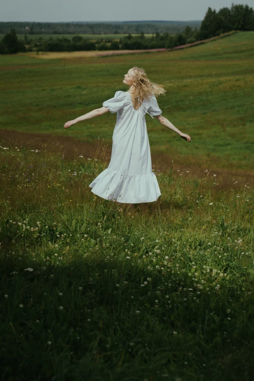 a woman in a white dress standing in a field, an album cover, pexels contest winner, kalevala, elle fanning), be running up that hill, carefree