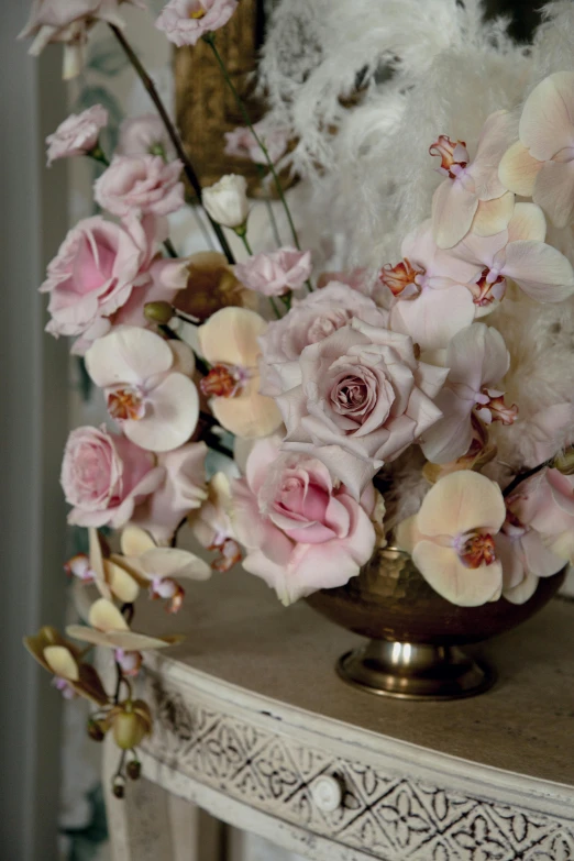 a vase filled with pink flowers on top of a table, inspired by Frederick Goodall, baroque, orchid, pastel roses, up close, overflowing