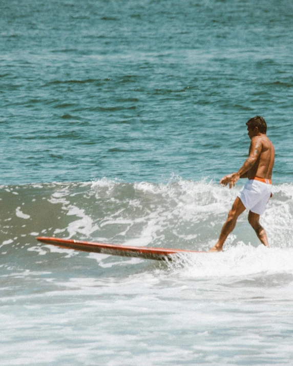 a man riding a wave on top of a surfboard, by Adam Dario Keel, pexels contest winner, renaissance, white skirt and barechest, joe keery, lgbtq, banner