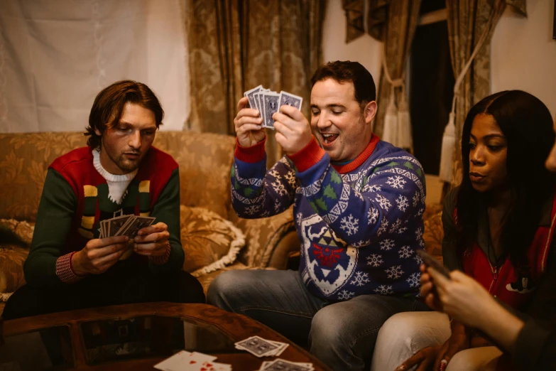 a group of people sitting around a table playing cards, a portrait, pexels contest winner, wearing festive clothing, avatar image, elliot alderson, 15081959 21121991 01012000 4k