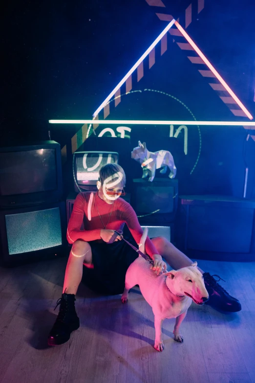 a man sitting on top of a couch next to a dog, an album cover, inspired by David LaChapelle, unsplash, holography, cyberpunk nightclub, lil peep, crown of (pink lasers), human dressed as a bull