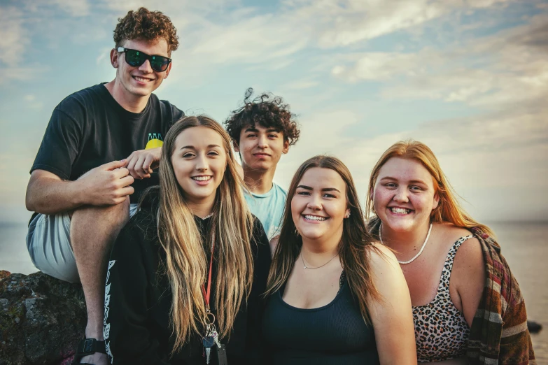 a group of young people standing next to each other, by Lee Loughridge, unsplash, deep dimples, summertime, te pae, high school