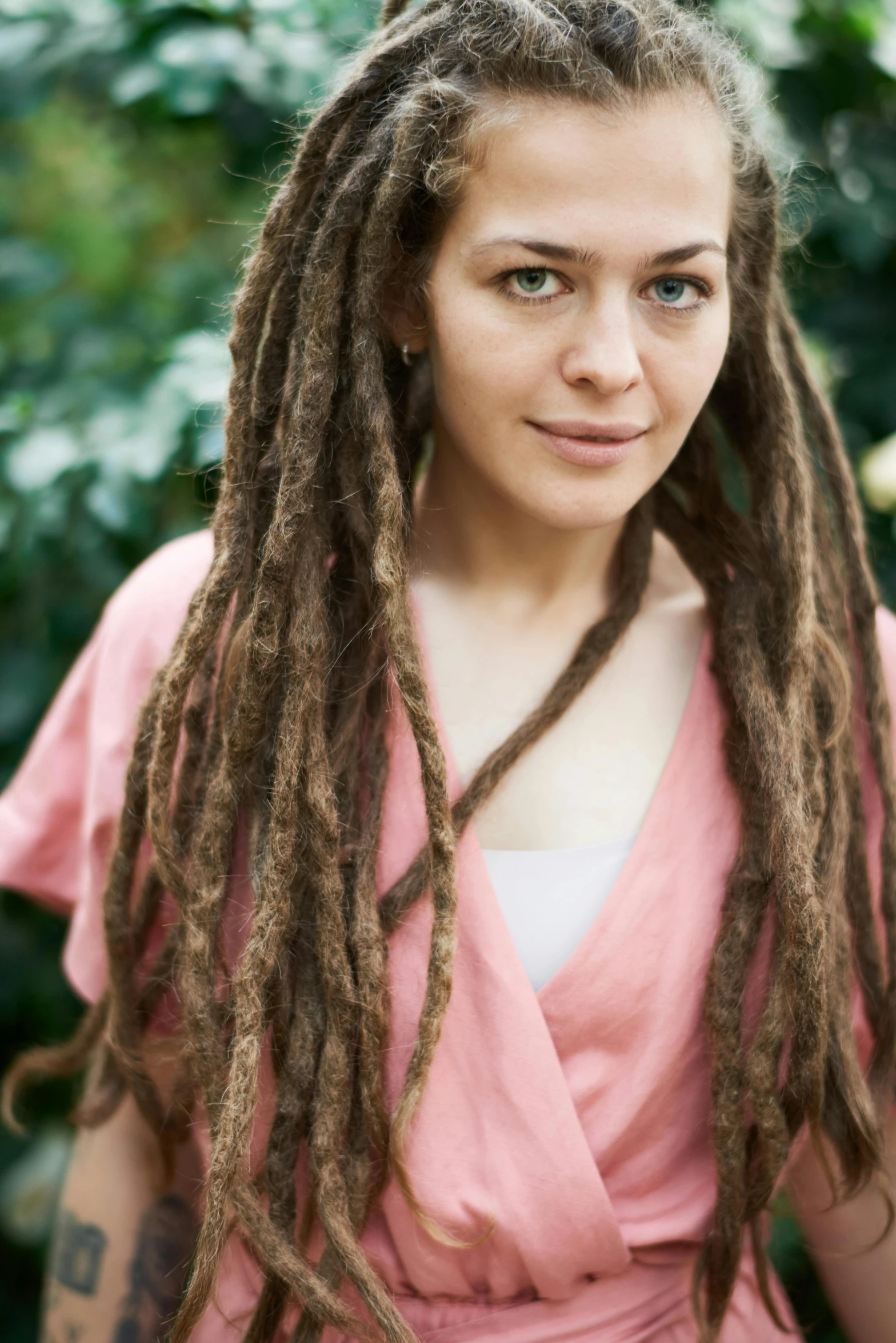 a woman with dreadlocks posing for a picture, inspired by Júlíana Sveinsdóttir, natural brown hair, mixed race, no cropping, bio-inspired