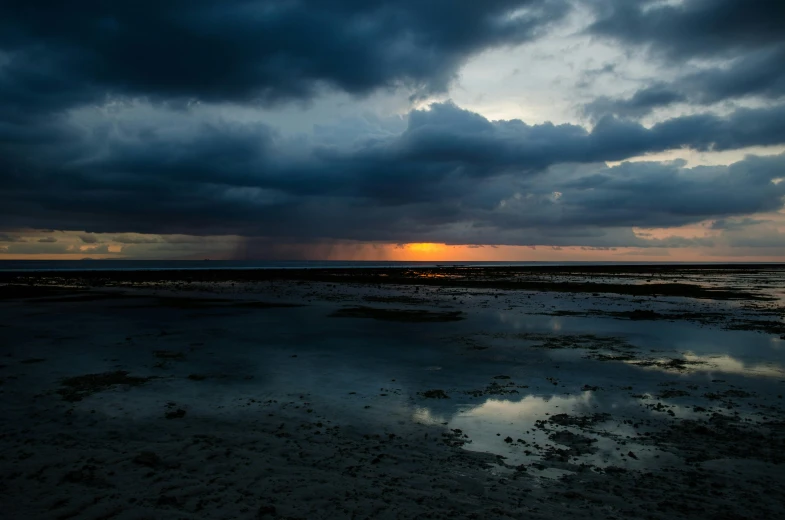 a large body of water under a cloudy sky, a picture, by Jan Tengnagel, unsplash, sunset dark dramatic day, monsoon on tropical island, afar, hd footage