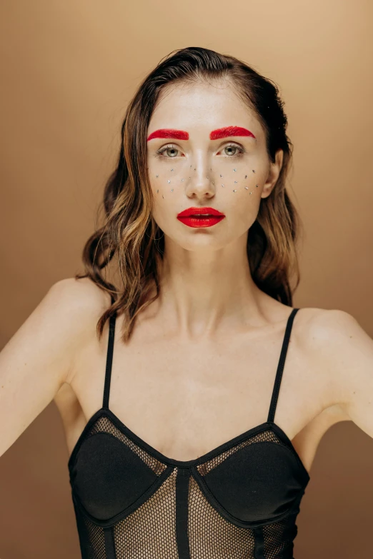 a woman wearing a black bra top and red lipstick, inspired by Hedi Xandt, trending on pexels, pop art, angular eyebrows, sparse freckles, bodypaint, one raised eyebrow