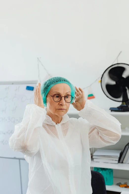 a woman in a lab coat adjusts her glasses, by Adam Marczyński, pexels contest winner, renaissance, with rap cap on head, elderly, in a foggy office, bald patch