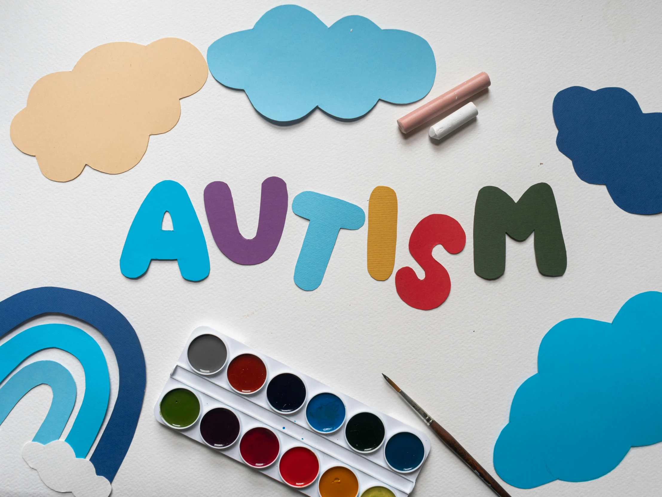 a white table topped with lots of paper cut outs, a child's drawing, inspired by Augustyn Mirys, trending on pexels, surreautistic, colorful medical equipment, andy milonakis, a wooden