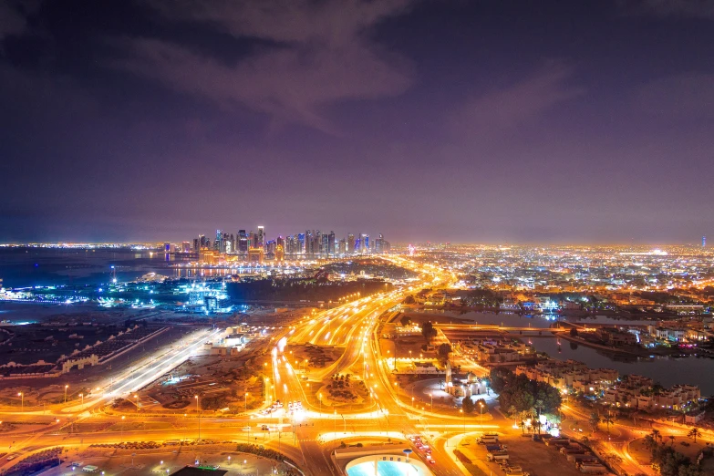 an aerial view of a city at night, pexels contest winner, ameera al taweel, ultrawide lens”, bright lights, high quality image”