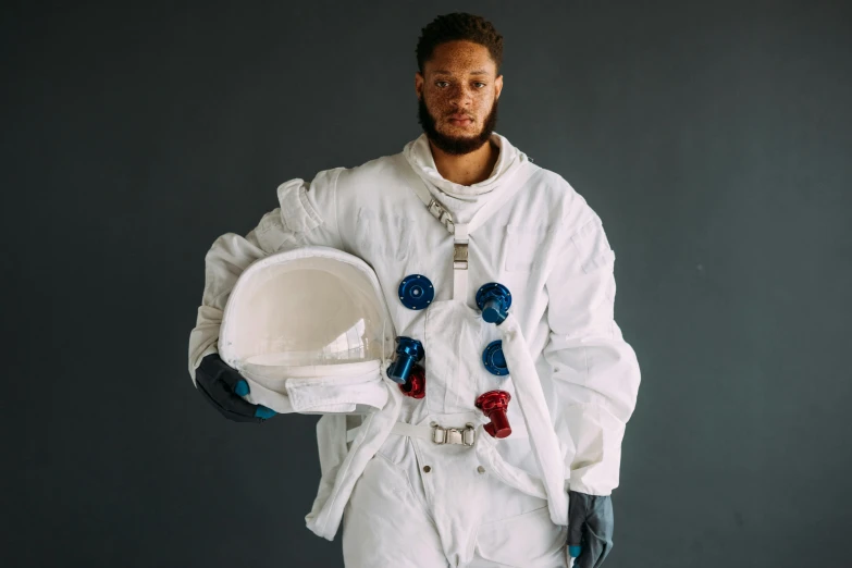 a man in an astronaut suit holding a helmet, pexels contest winner, pete davidson, malcolm hart, game ready, portrait of tall