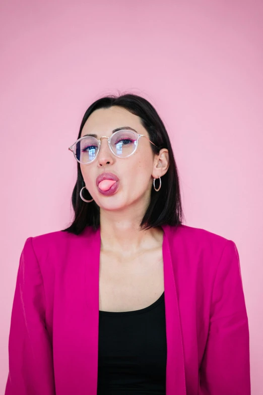 a woman wearing glasses making a funny face, inspired by Ion Andreescu, trending on pexels, ((pink)), kissing, bubble, influencer