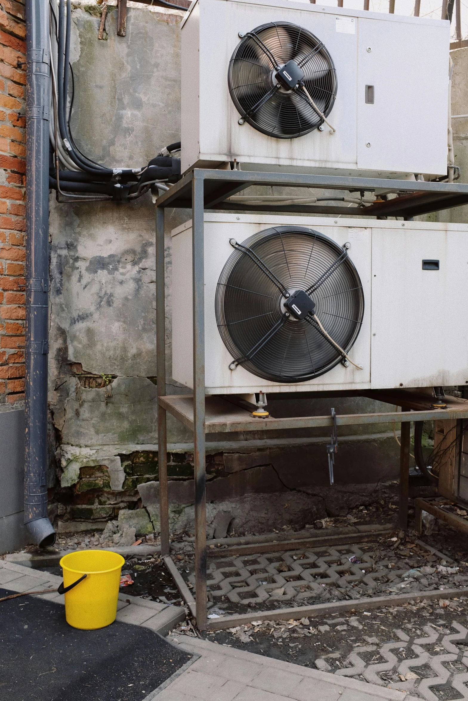 a couple of air conditioners sitting on top of a building, a silk screen, by Jan Tengnagel, unsplash, renaissance, trash ; basement, low quality photo, mechanical detail, 3 4 5 3 1