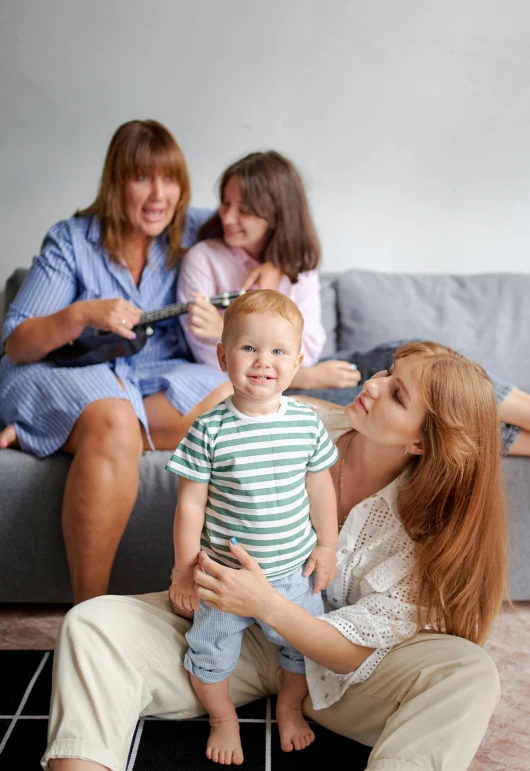 a woman combing a baby's hair while sitting on a couch, incoherents, groups of happy humans, slide show, promotional image, 4k image