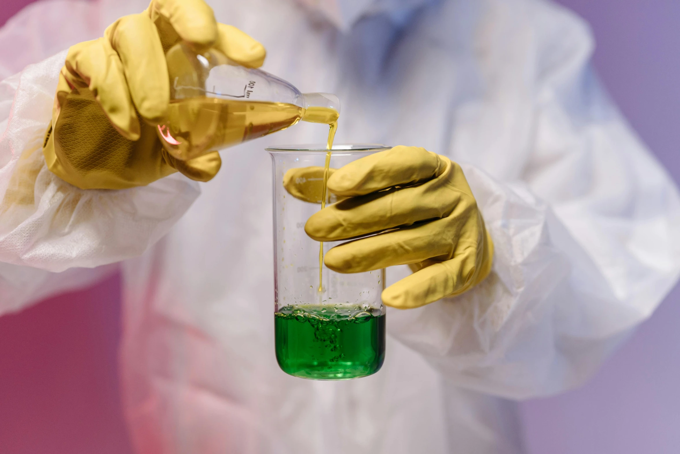 a person in a lab coat pouring liquid into a beakle, unsplash, process art, yellow latex gloves, green magenta and gold, dangerous chemical hazards, engineering