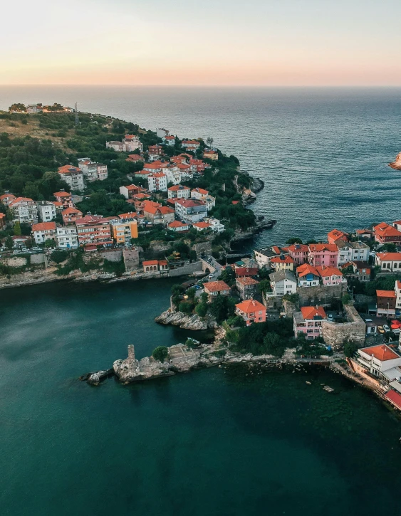 a small town in the middle of a body of water, black sea, profile image, lush surroundings, flatlay