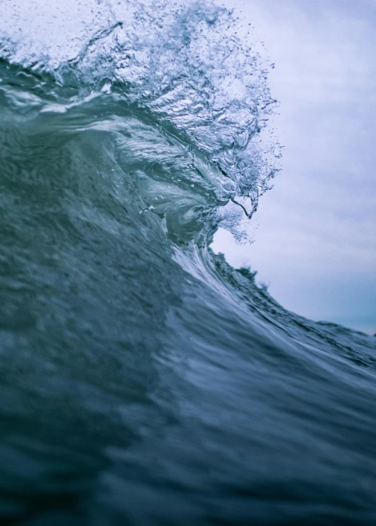 a man riding a wave on top of a surfboard, an album cover, unsplash contest winner, renaissance, paul barson, rippling muscles, photo of the middle of the ocean, water particulate