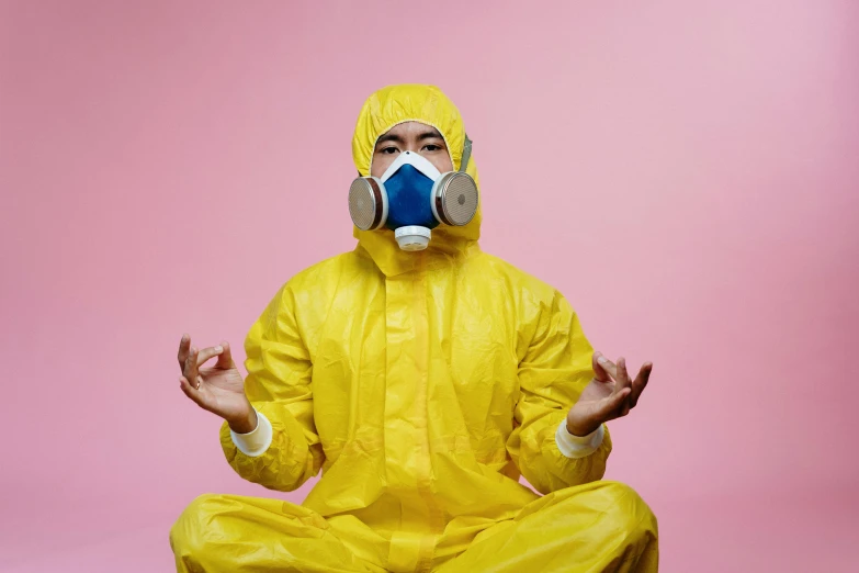 a man in a yellow hazmat suit meditating, by Julia Pishtar, pexels, nuclear art, pink, wearing plumber uniform, surgical mask covering mouth, avatar image