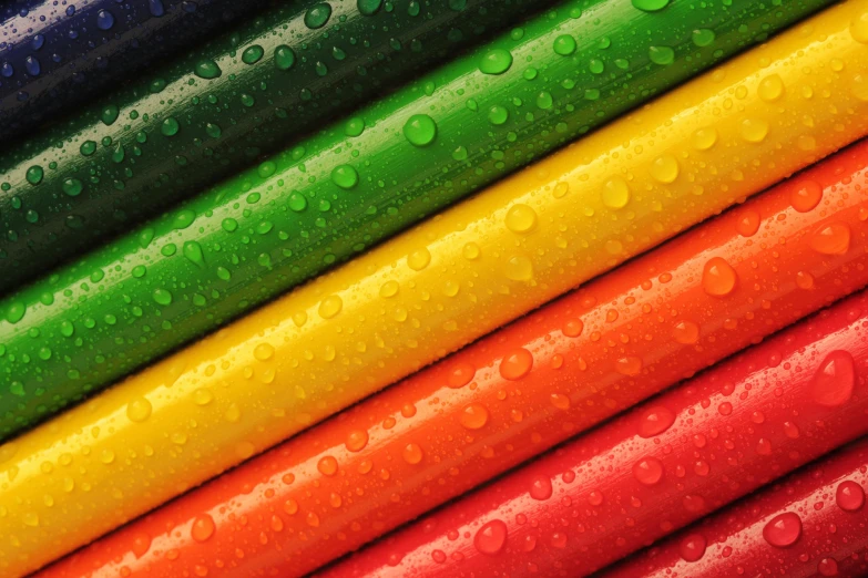 a close up of a rainbow colored background, pexels, crayon art, rainbow tubing, rainy wet, colorful uniforms, colours red and green