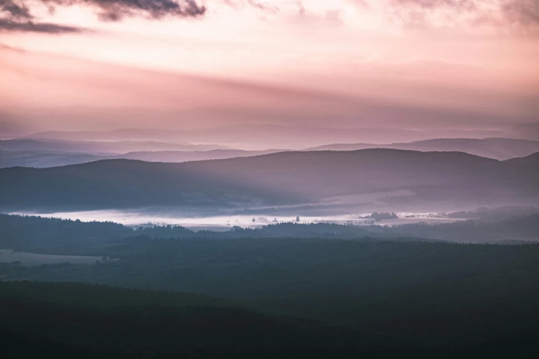 a view of the mountains from the top of a hill, by Adam Marczyński, pexels contest winner, romanticism, light pink mist, forest plains of yorkshire, fine art print, grey